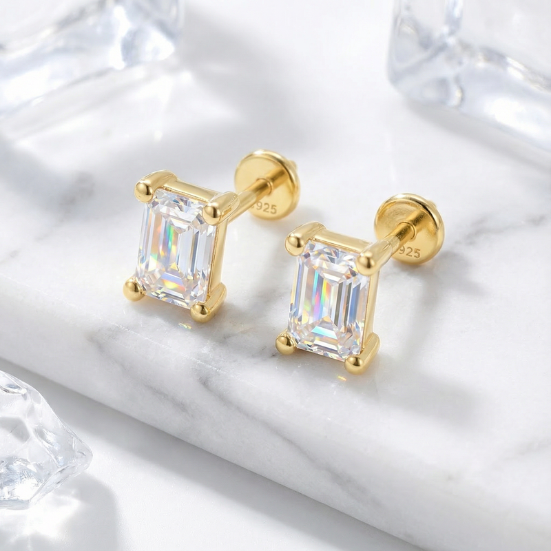 Close-up of baguette cut simulated diamond stud earrings in 18K gold vermeil showing the flat back posts.
