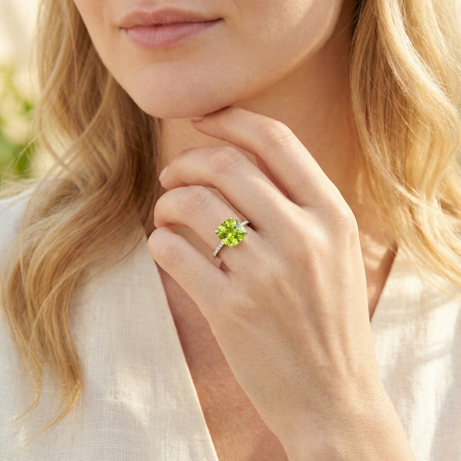 Model wearing the Elianise cushion-cut simulated peridot ring in S925 sterling silver with a white shirt.