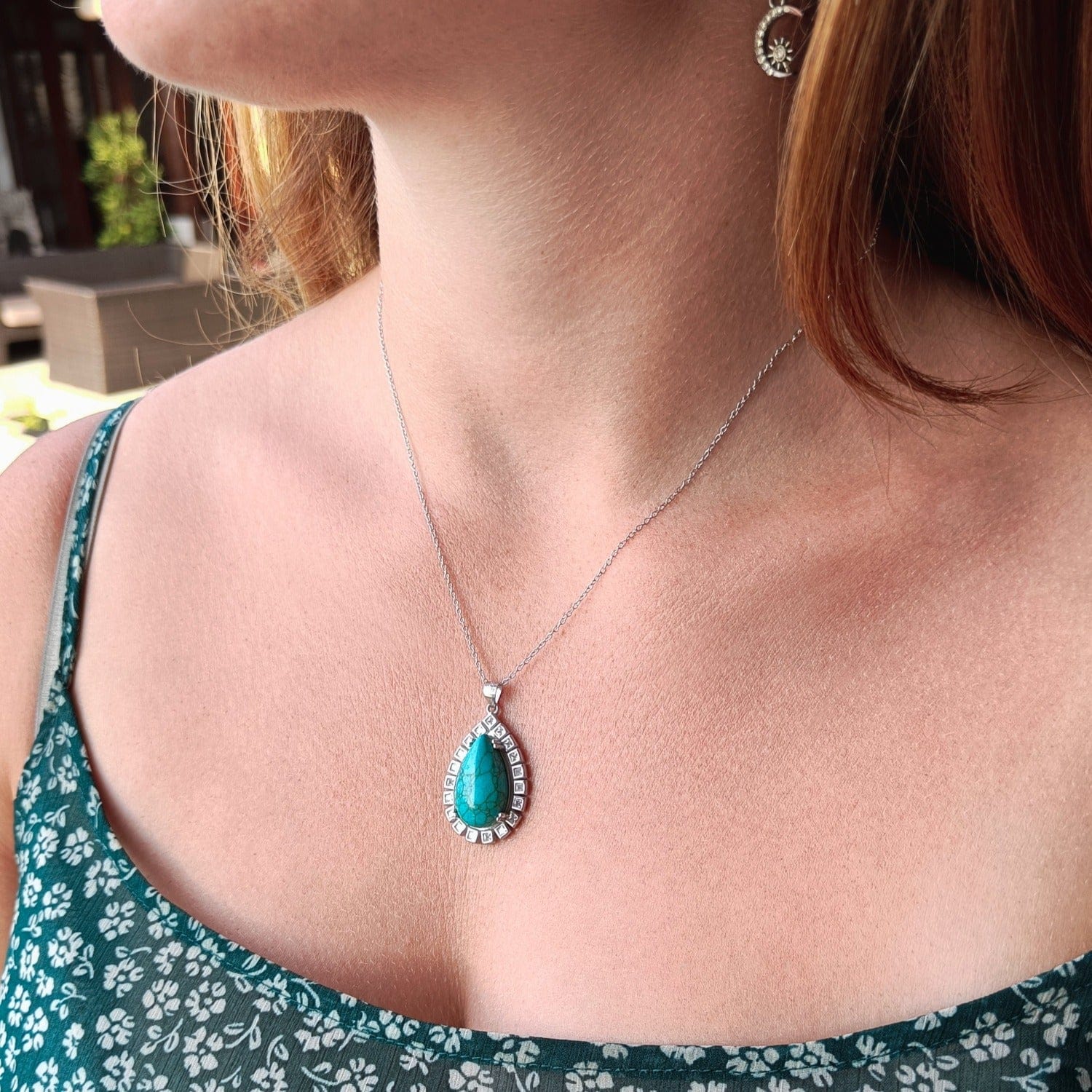 Azure Oceanic Pendant Necklace with a stunning turquoise stone set in sterling silver on a model zoomed out user generated content review