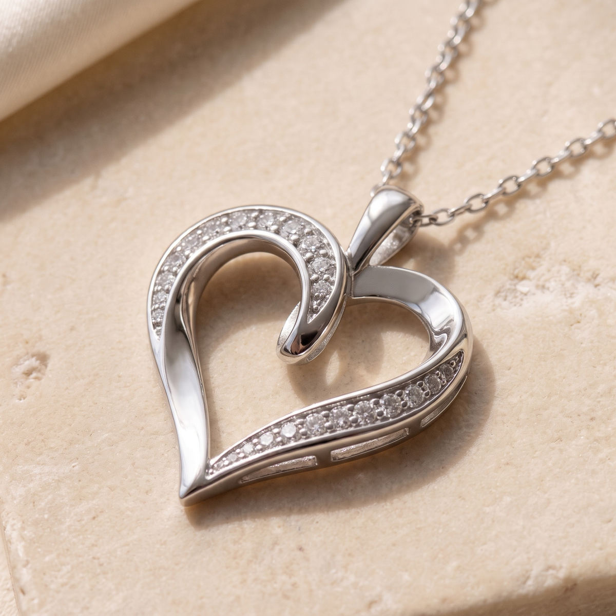 Diamond Ribbon Heart Pendant — Silver 45-degree macro closeup