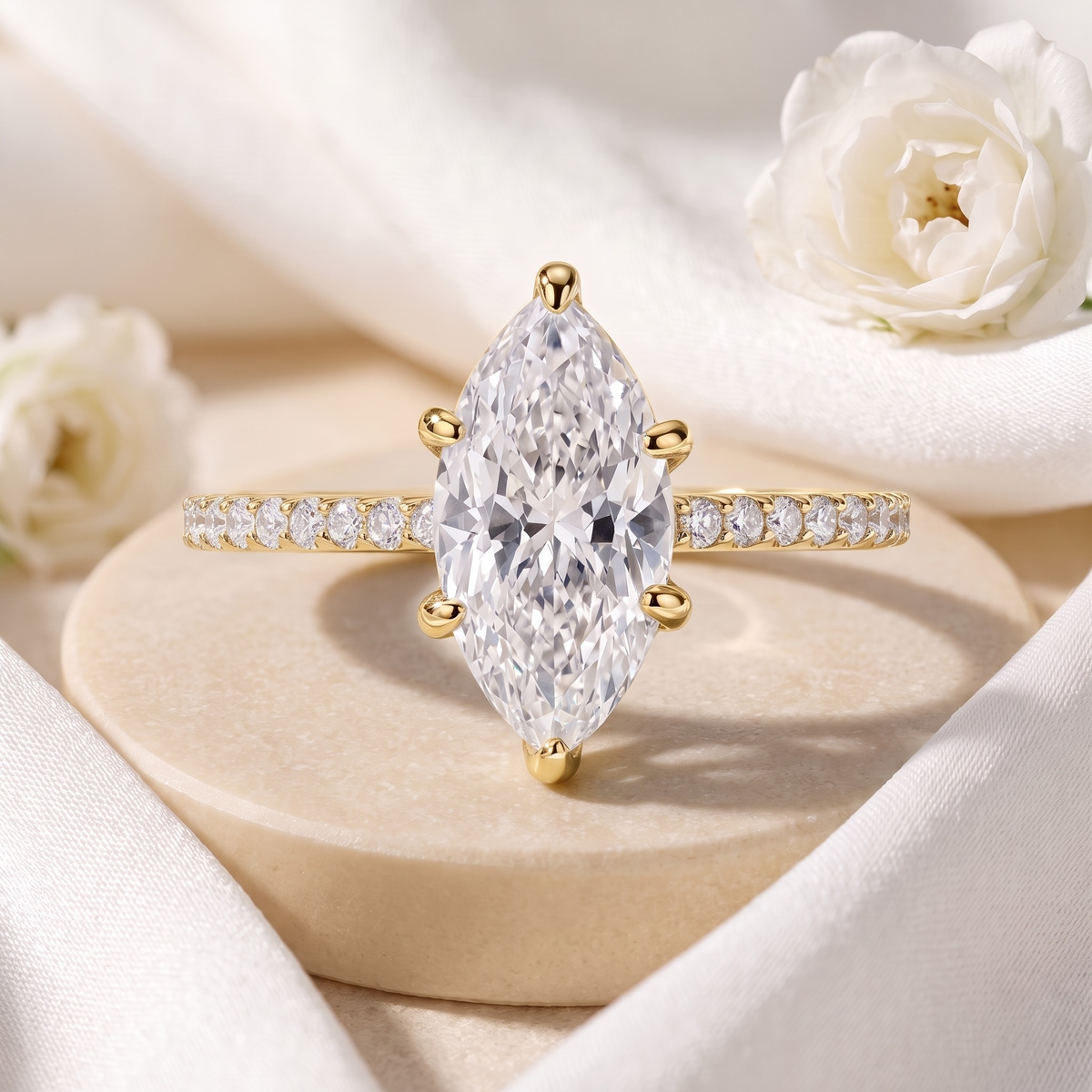 Six-prong marquise moissanite ring in yellow gold, front product view.