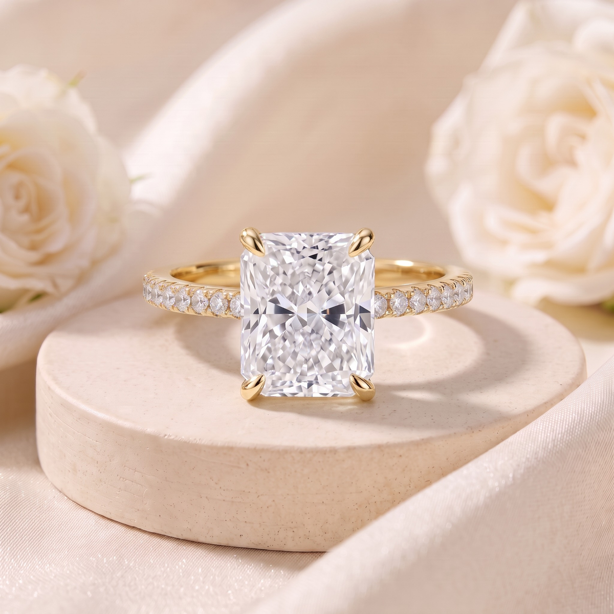 Radiant-cut moissanite ring in yellow gold, front product view.