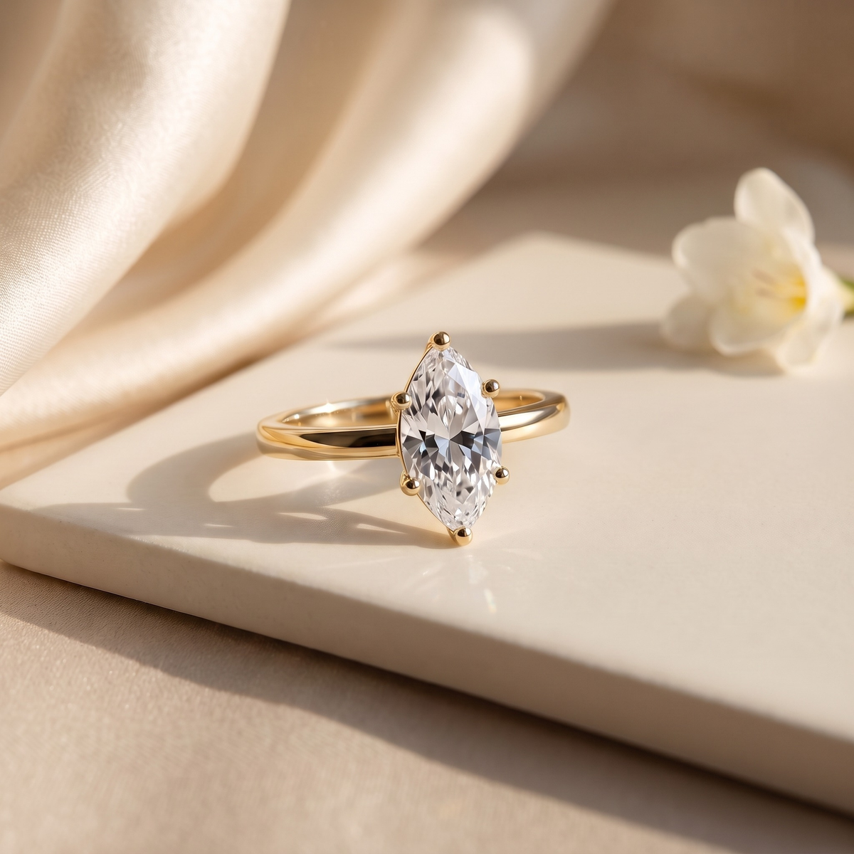 1CT marquise moissanite solitaire in yellow gold, isolated product view