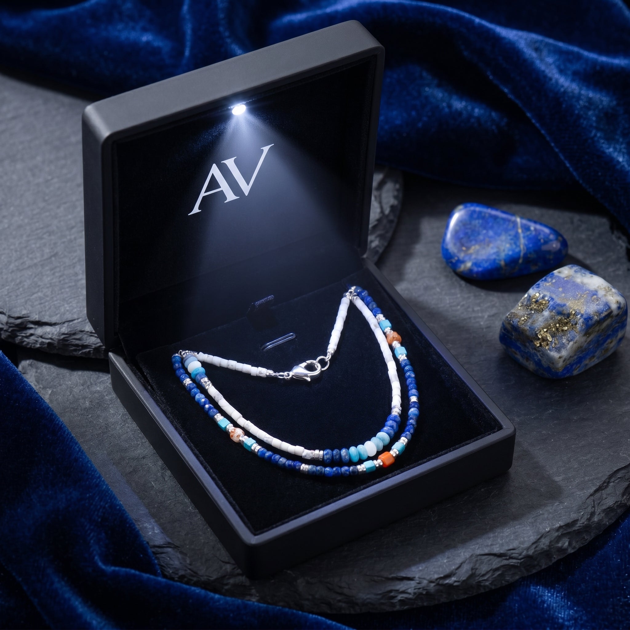 Layered Altair natural lapis lazuli necklace with silver-toned clasp in a black LED-lit gift box.