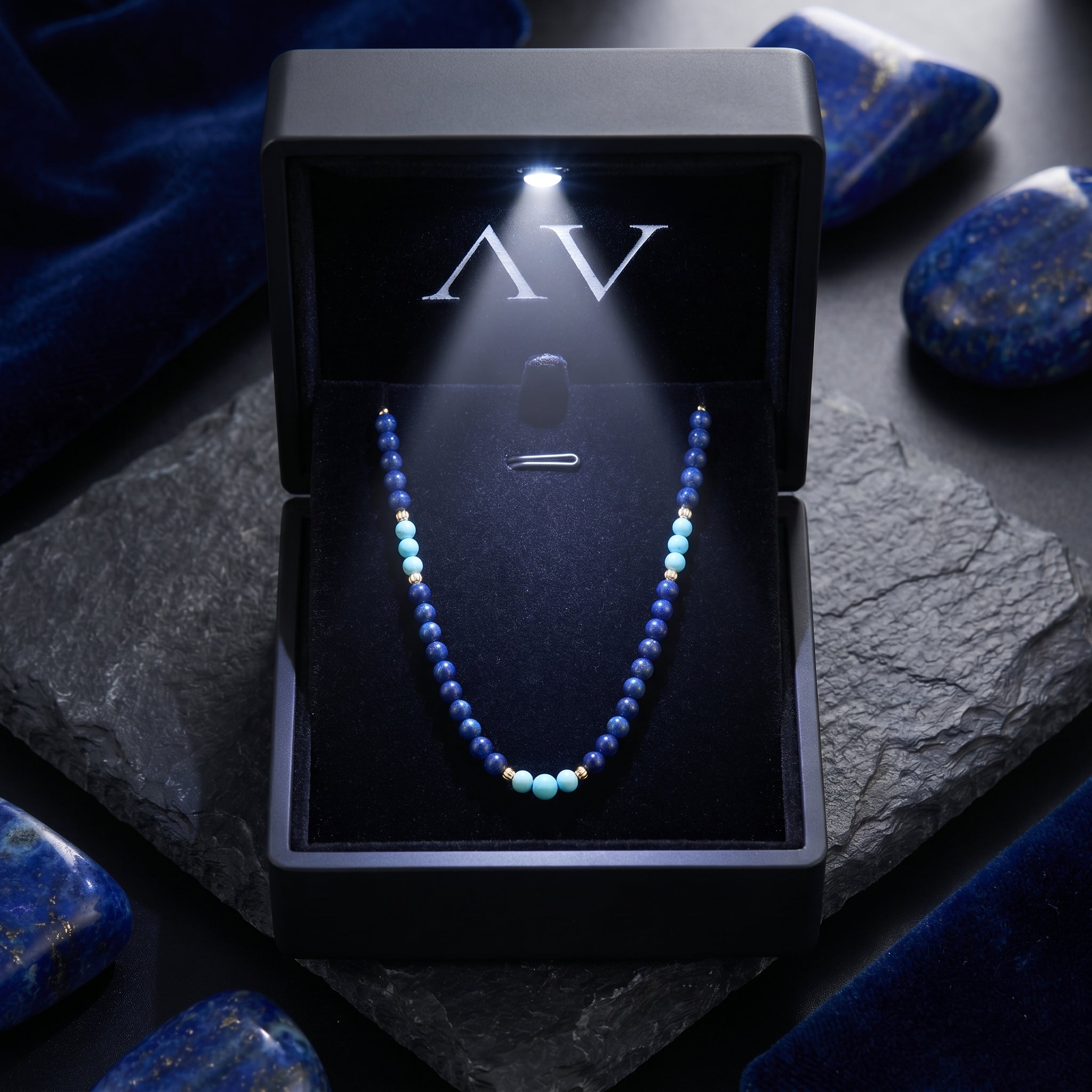 Lapis lazuli and gold bead necklace presented in a premium black LED-lit jewelry gift box.