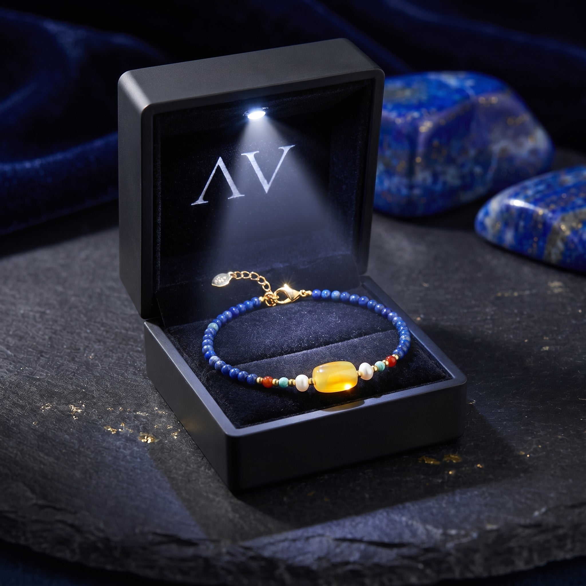 Azure Melody lapis bracelet with 18K gold plating in a premium black LED-lighted jewelry gift box.