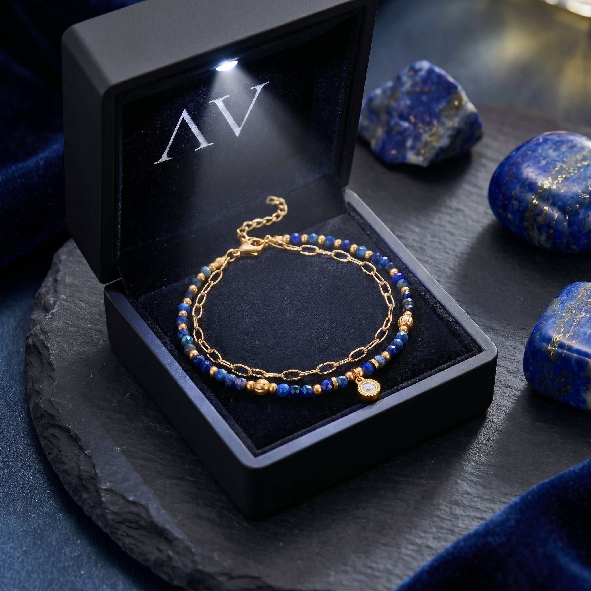 Lapis lazuli and 18k gold plated bracelet displayed in a premium black LED-lit jewelry gift box.