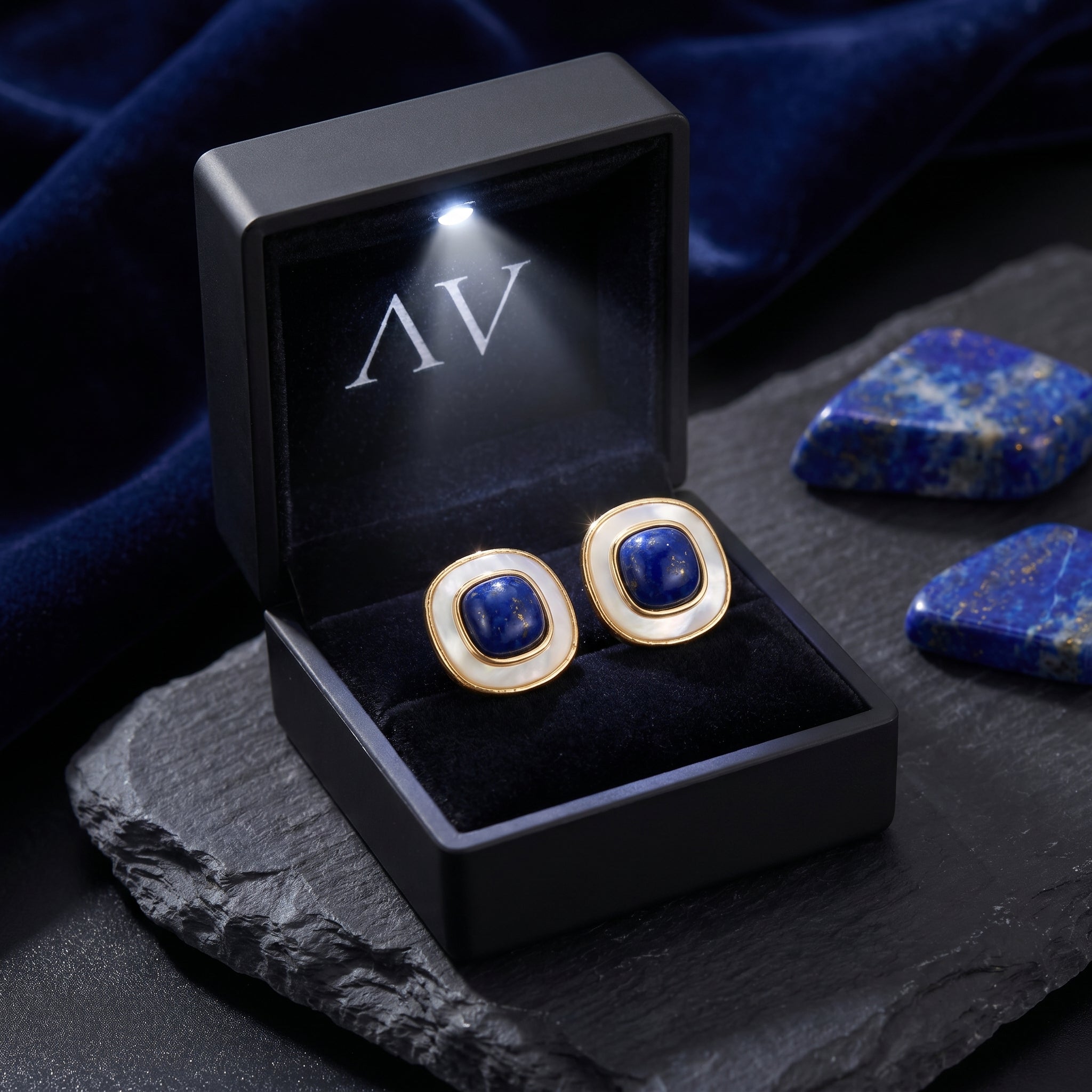 Gold-plated natural lapis lazuli earrings presented in a black LED-lit jewelry gift box.