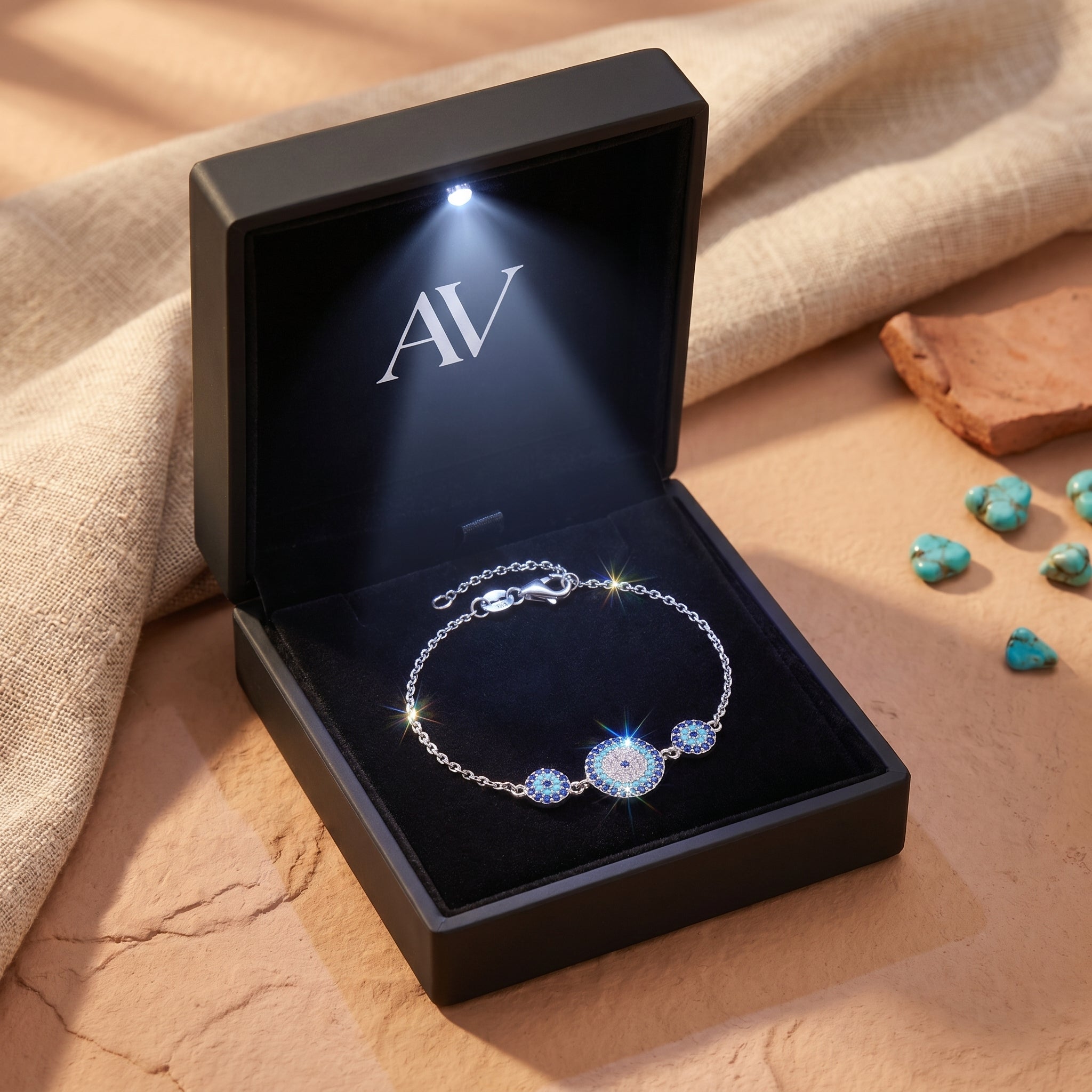 Paloma turquoise silver bracelet displayed inside a black LED-lit jewelry gift box with AV branding.