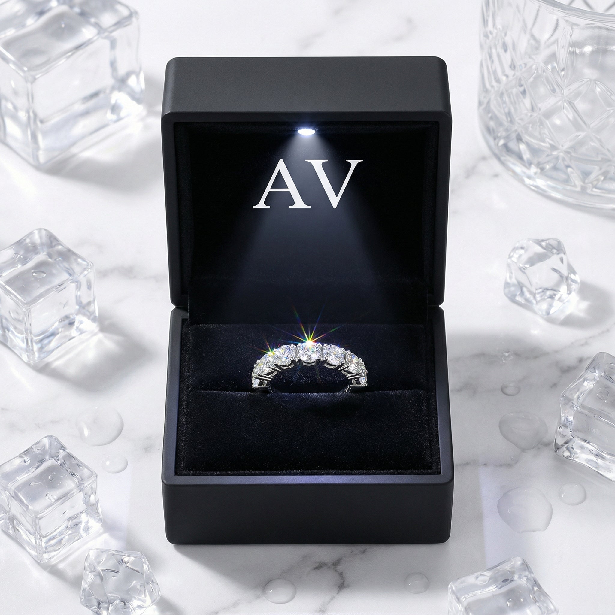 Lucianne sterling silver simulated diamond ring inside a black LED lighted jewelry box with AV branding.