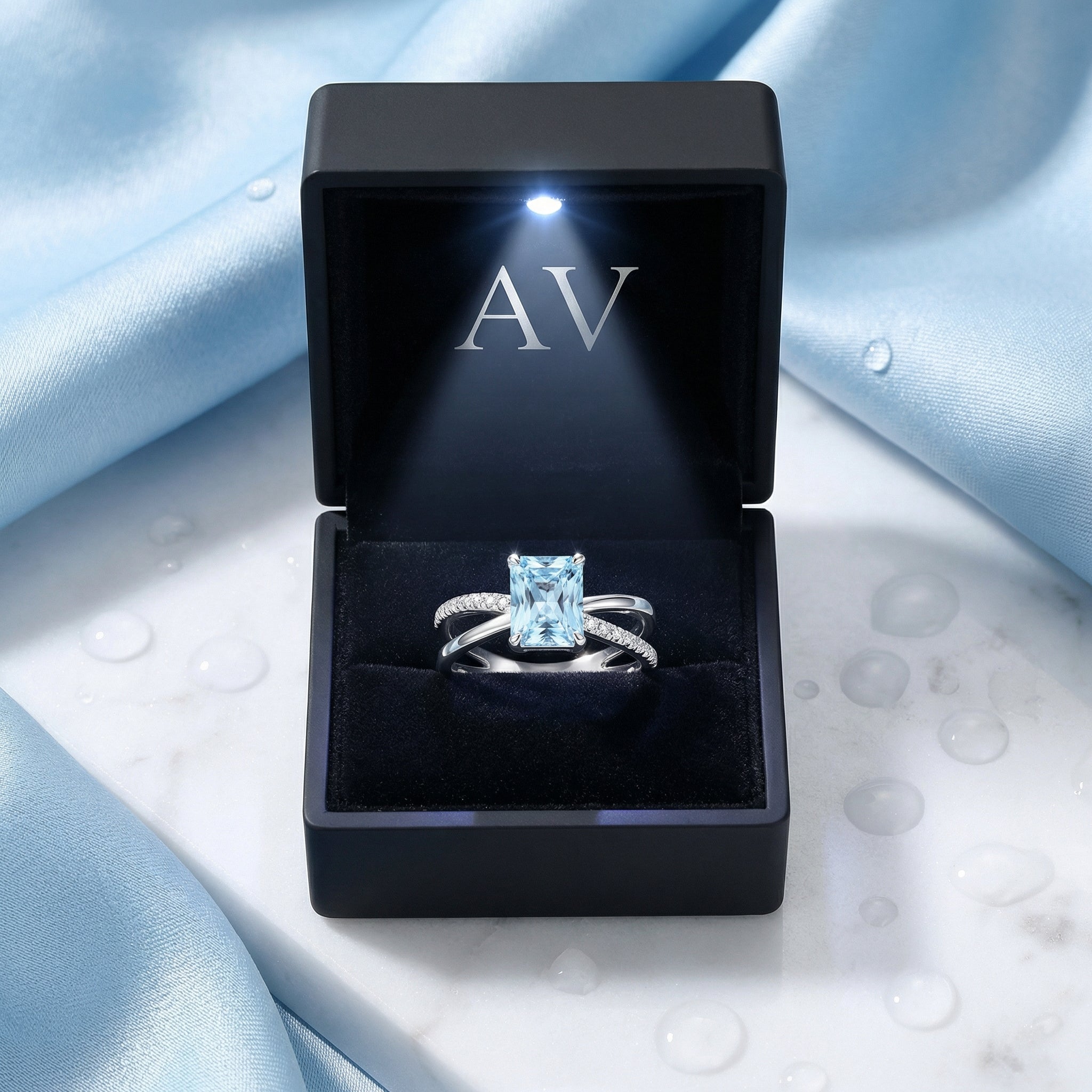 S925 sterling silver emerald cut aquamarine ring presented in a black LED-lit jewelry gift box.