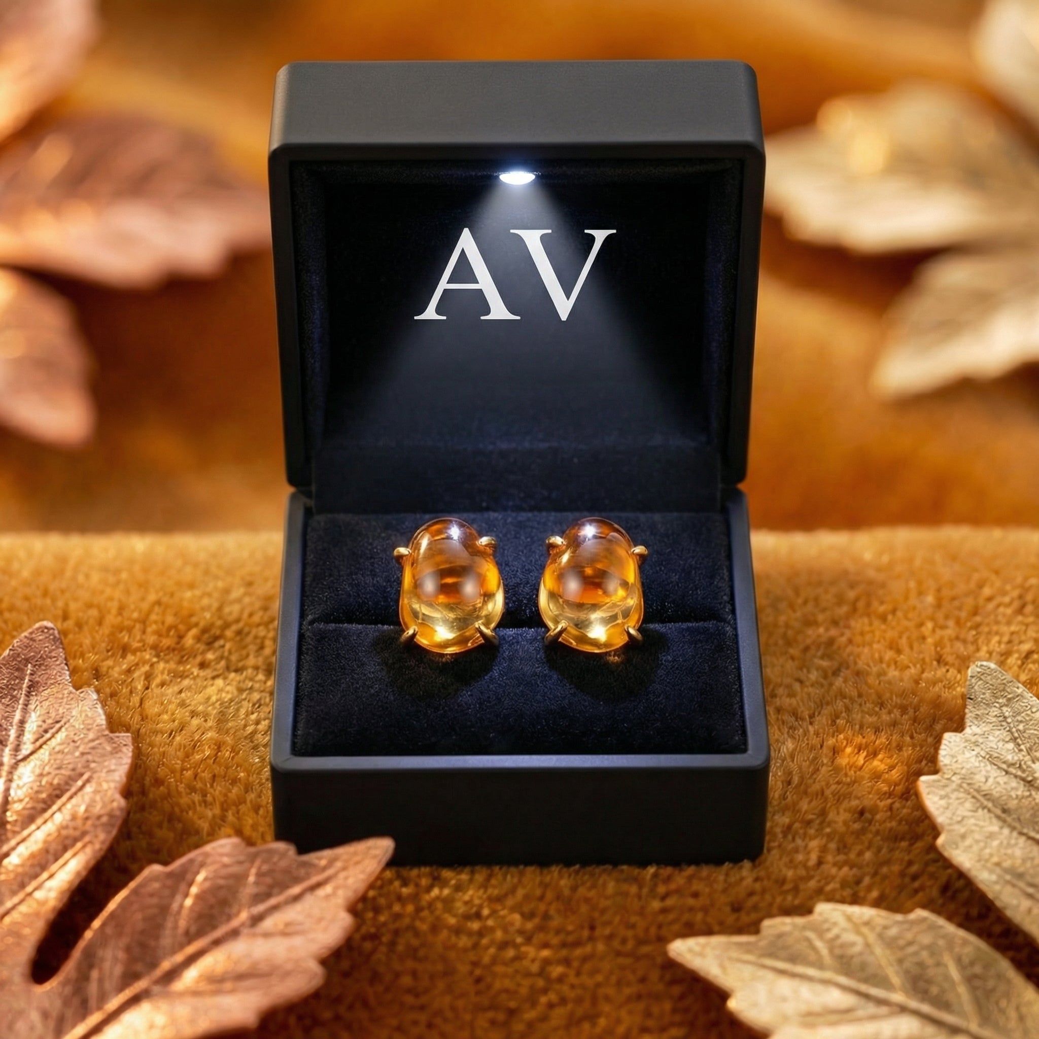 Amarantha 18K gold vermeil simulated topaz stud earrings in a black LED-lighted jewelry gift box.
