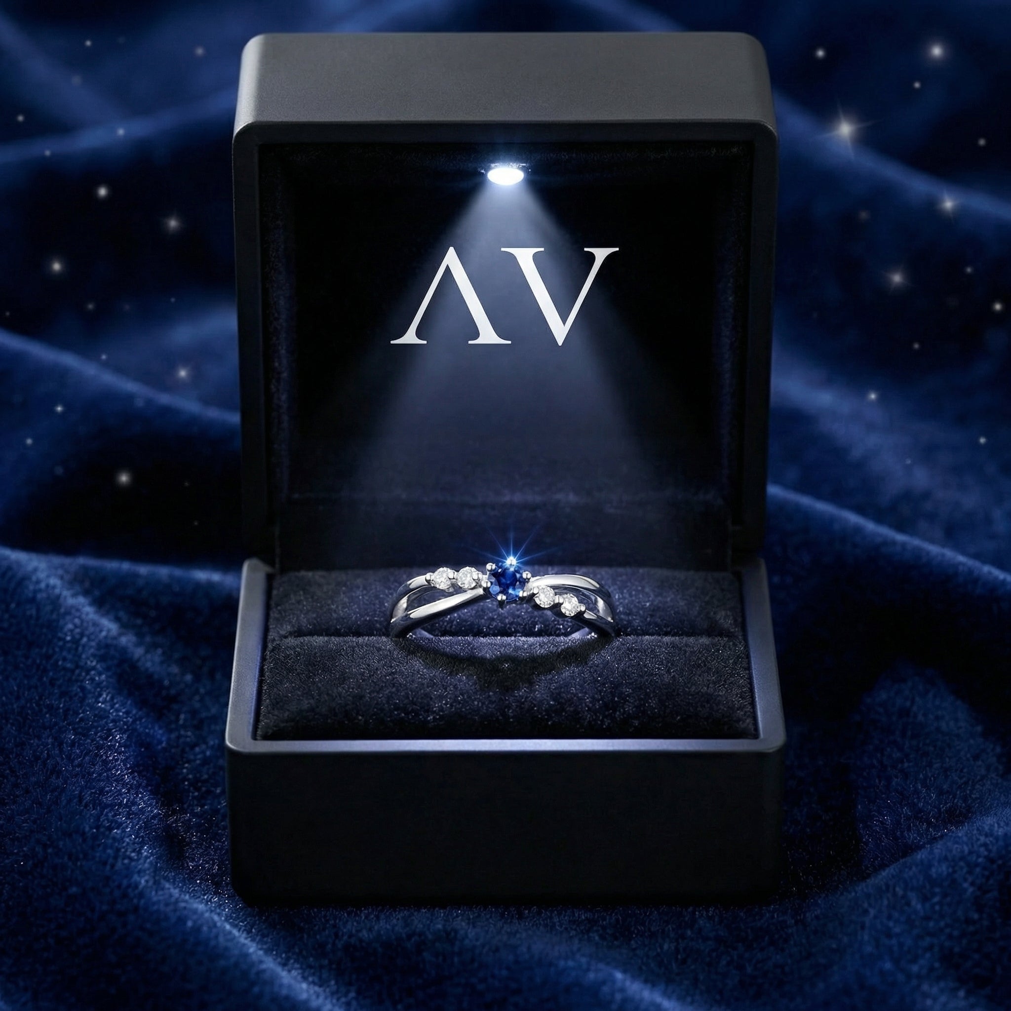 Isaraea S925 sterling silver blue sapphire twist ring inside a premium lighted black jewelry presentation box.