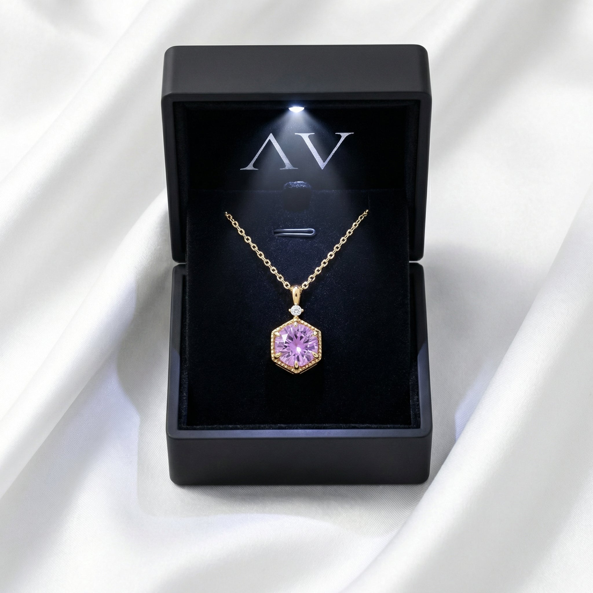 The Hesperia gold vermeil amethyst necklace presented in a black LED-lit jewelry gift box on white silk.