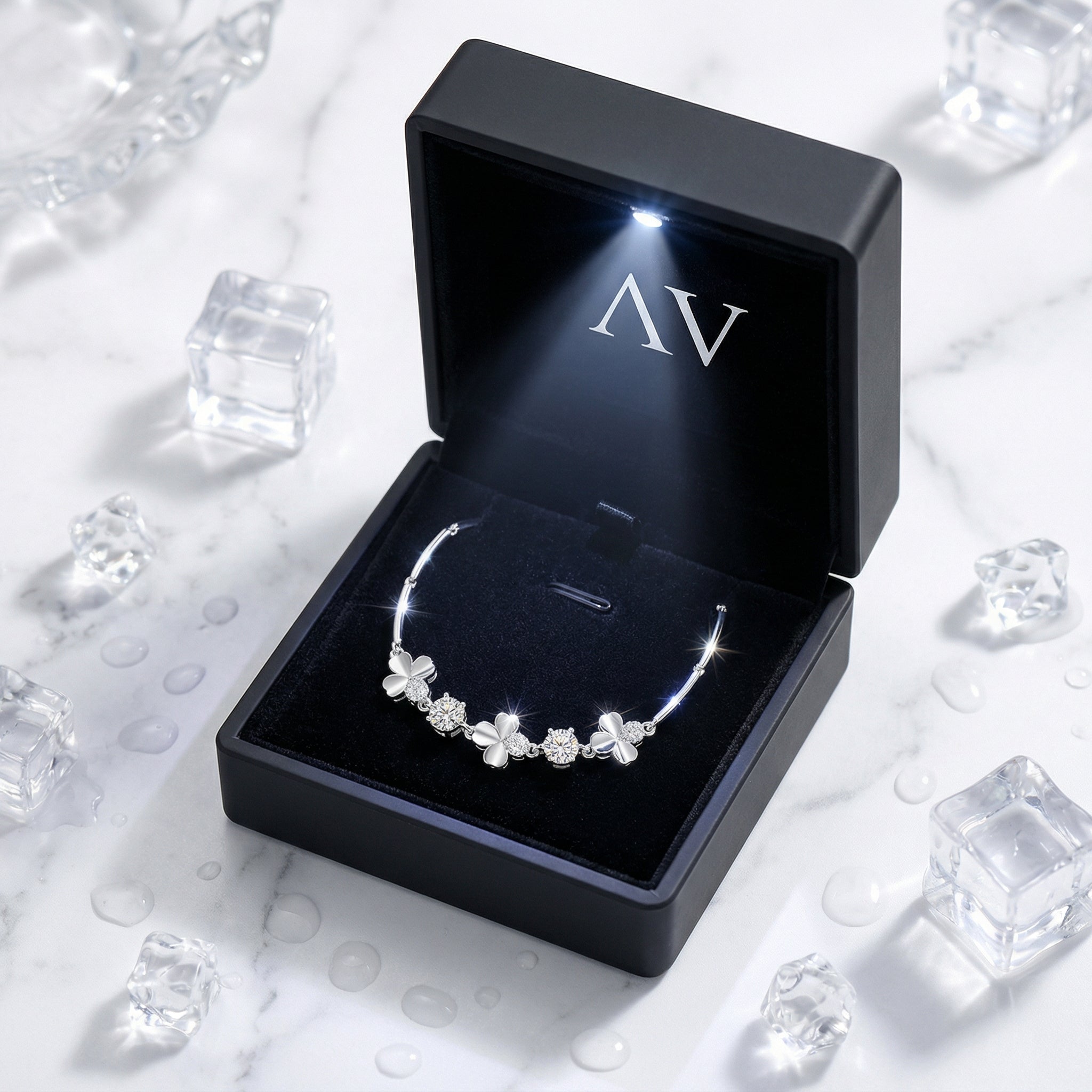 S925 sterling silver clover bracelet with simulated diamonds inside a black LED-lit jewelry presentation box.