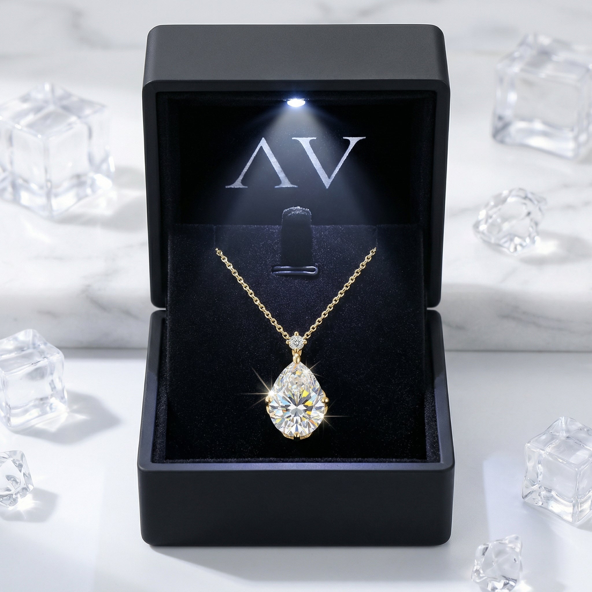 Front view of the Elianna teardrop necklace in 18K gold vermeil inside a premium LED-lit jewelry presentation box.