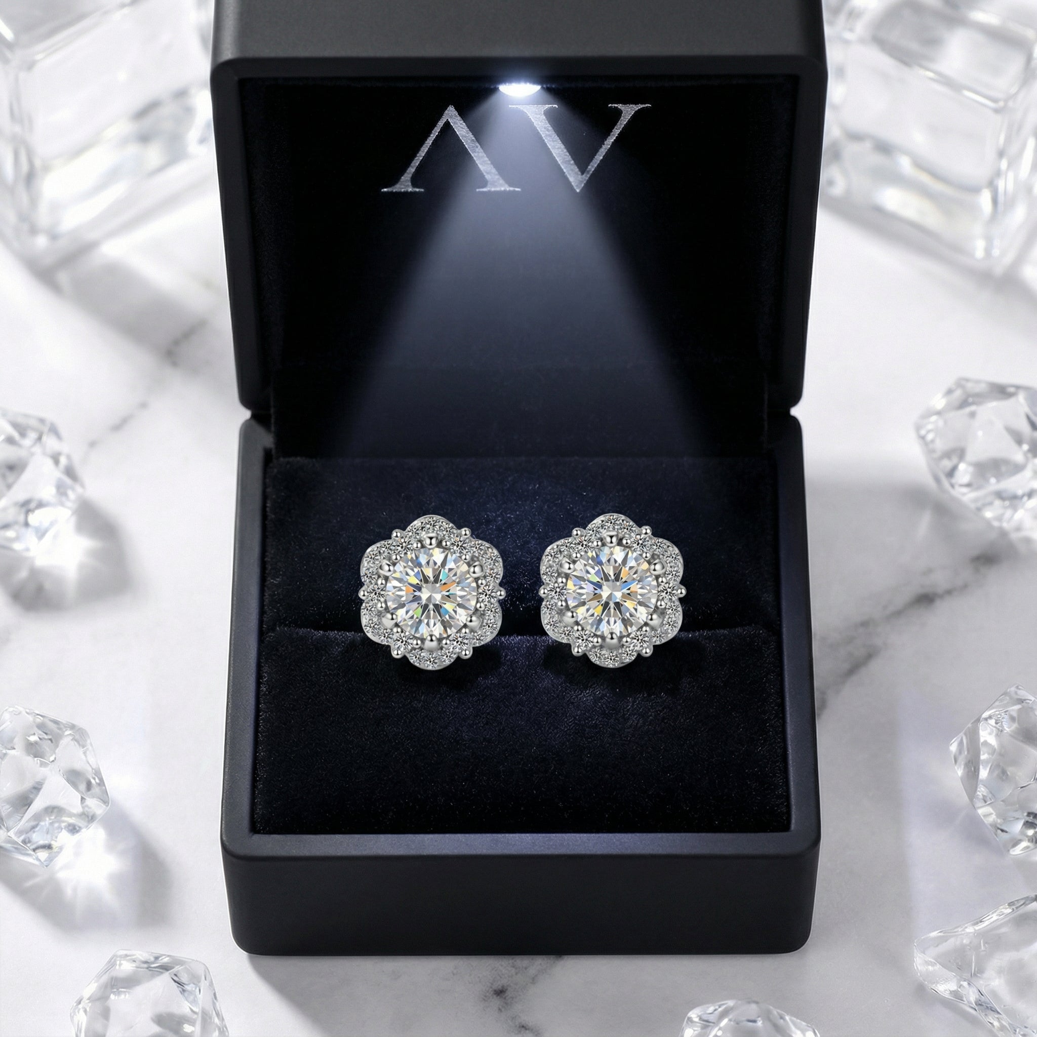 Isolde halo stud earrings in S925 sterling silver presented in a black lighted jewelry gift box.