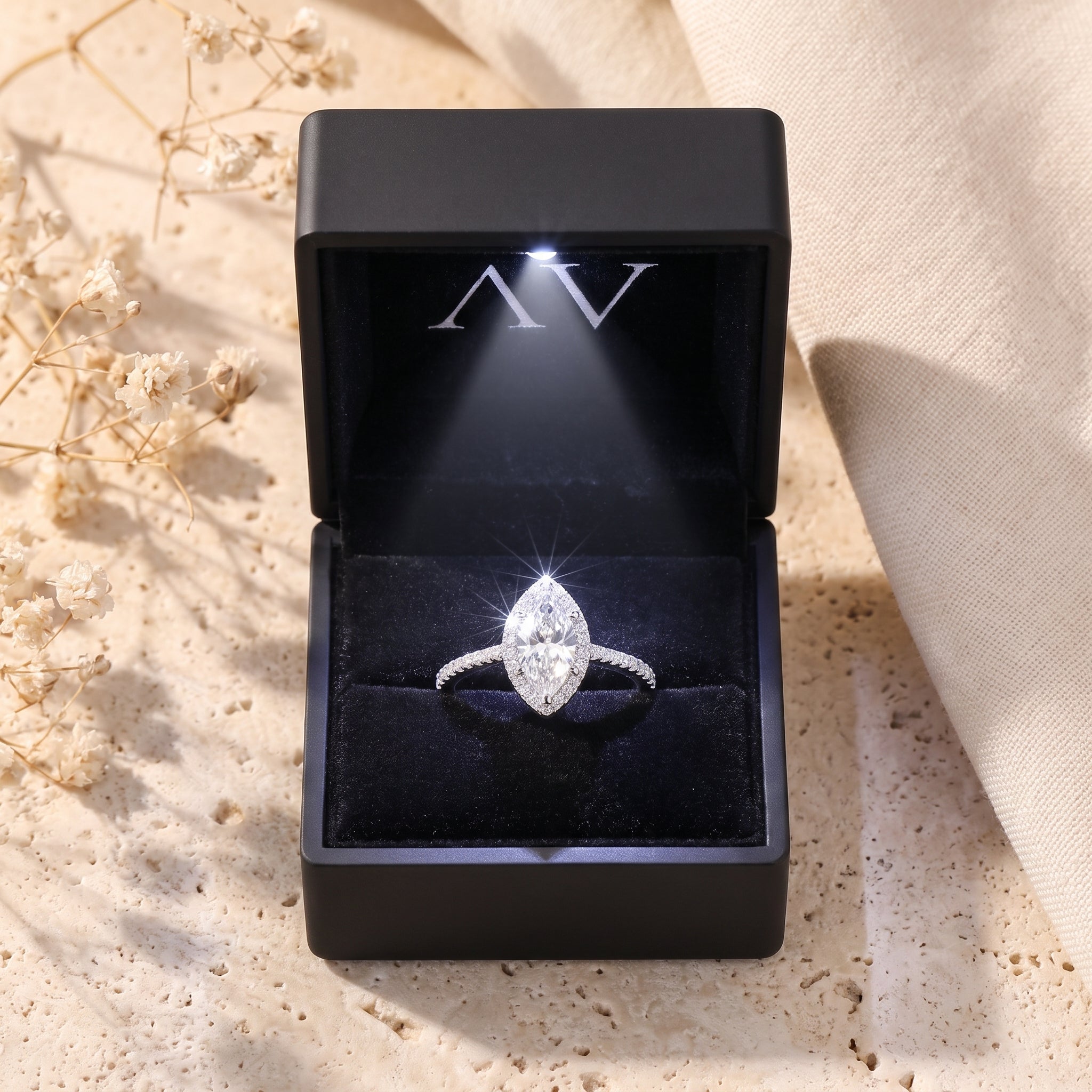 Marquise halo promise ring in S925 sterling silver presented in a lighted black jewelry gift box.