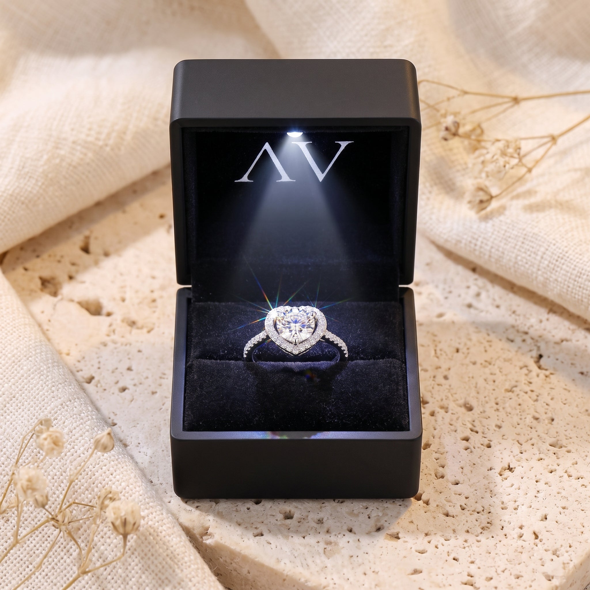 S925 sterling silver heart halo ring presented in a lighted black jewelry gift box.