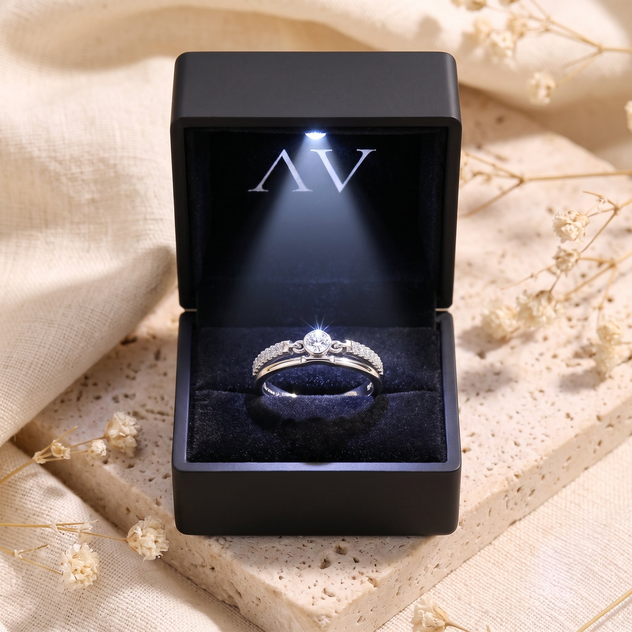 Lyra silver double band ring inside a black LED-lighted jewelry gift box.