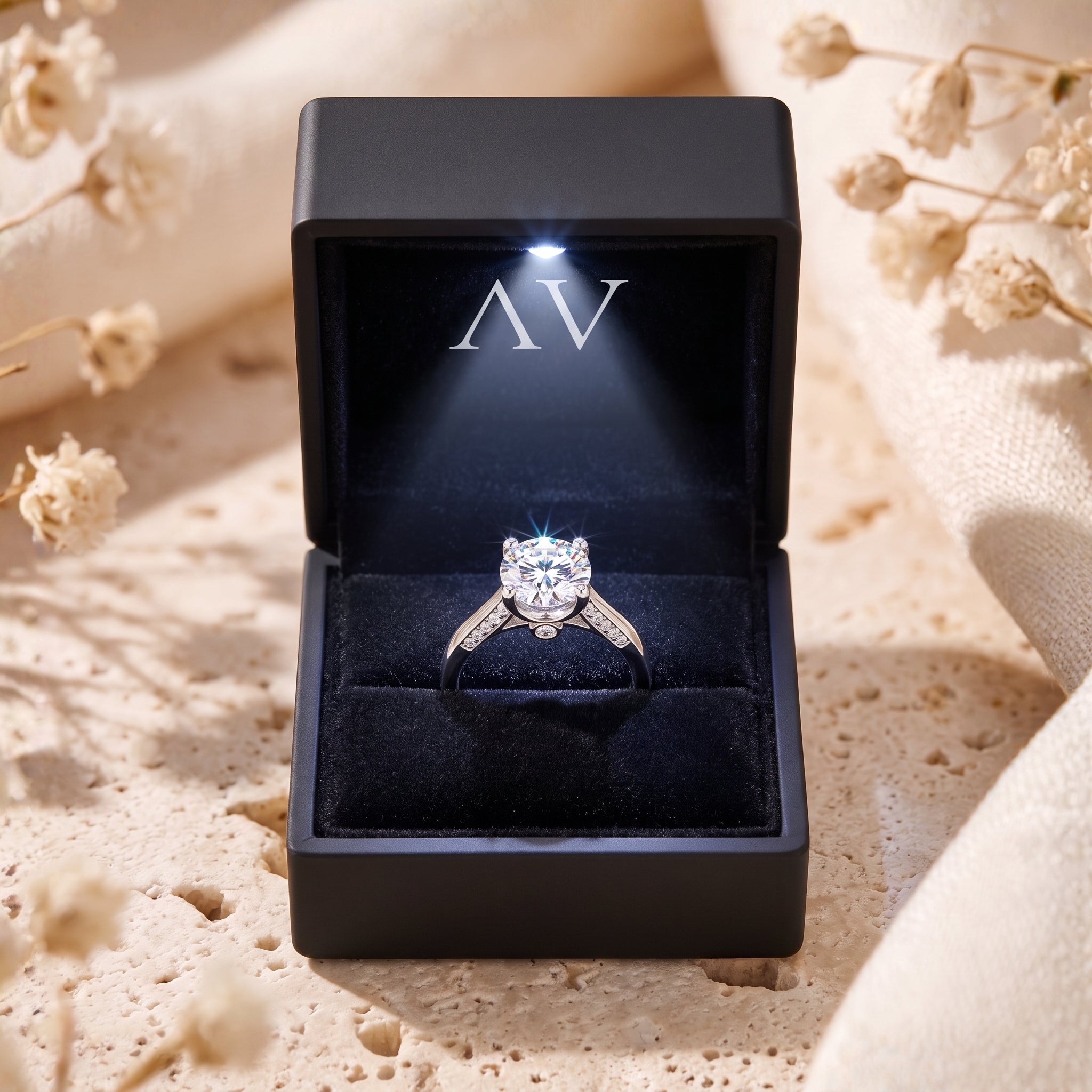 Round CZ silver ring in black lighted gift box.