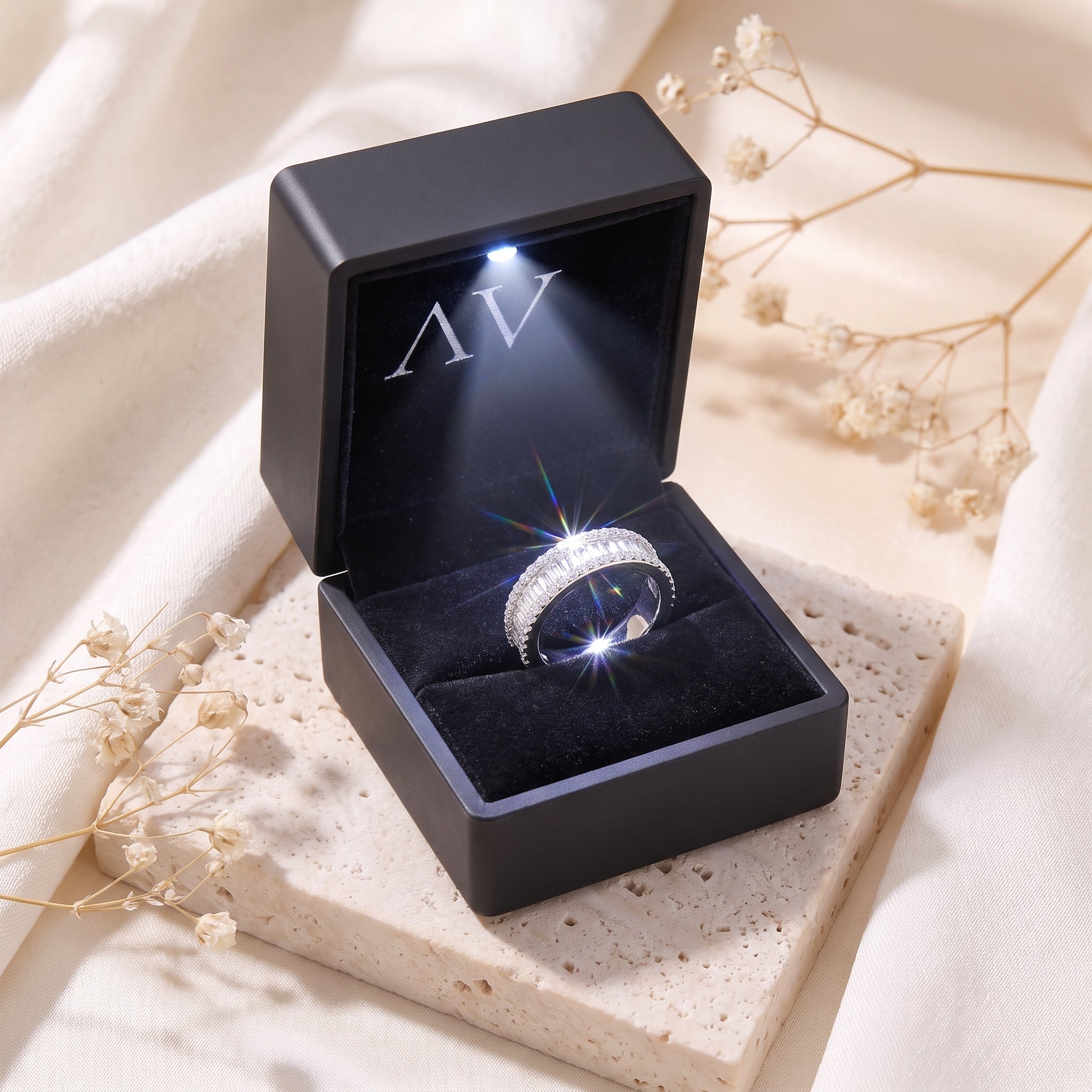 S925 sterling silver baguette cubic zirconia ring inside a black illuminated LED jewelry gift box.