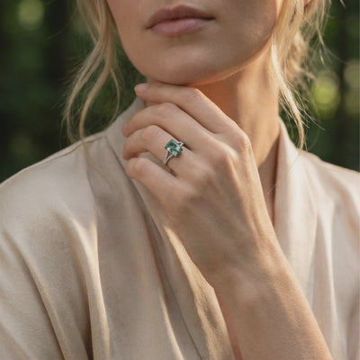 A solid gold ring with a natural moss agate gemstone and moissanite accents.