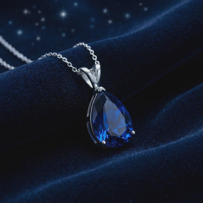 Sapphire Blue Moissanite pendant necklace in solid gold.