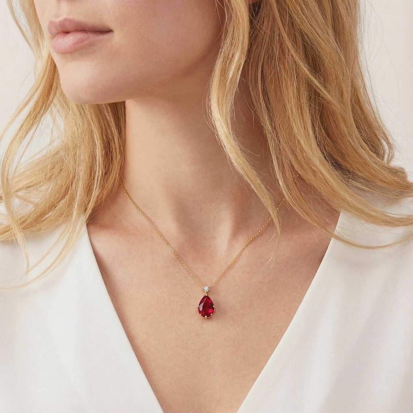 The Celestara Teardrop simulated ruby necklace in solid gold.