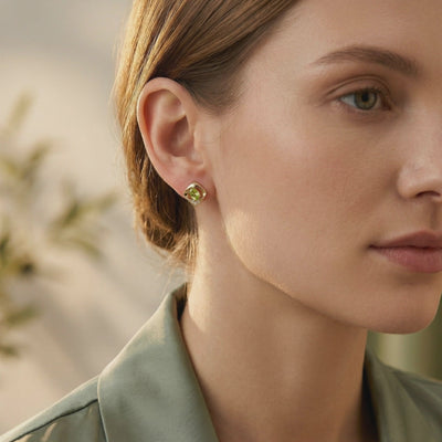Peridot Oval Stud Earrings in solid gold.