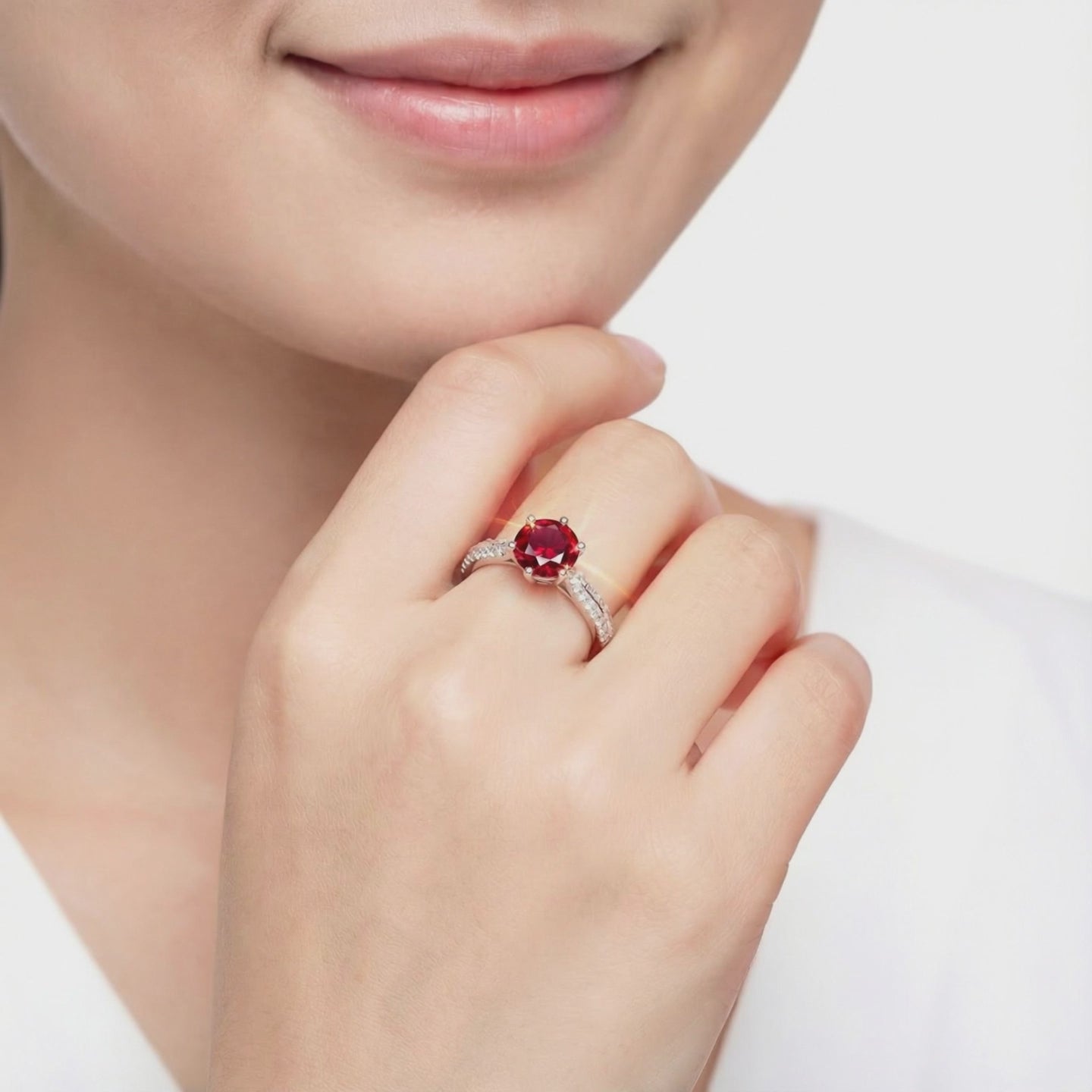 Simulated ruby solitaire ring in solid gold.