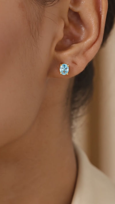 Oval Simulated Aquamarine Solid Gold Stud Earrings.