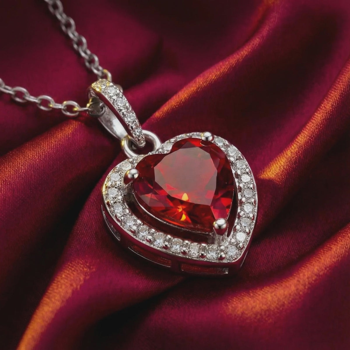 Heart-cut simulated ruby pendant necklace in solid gold.