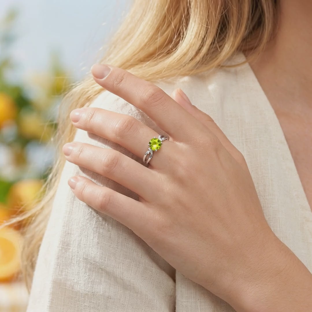 Zelinda bypass ring in solid gold with a simulated peridot.