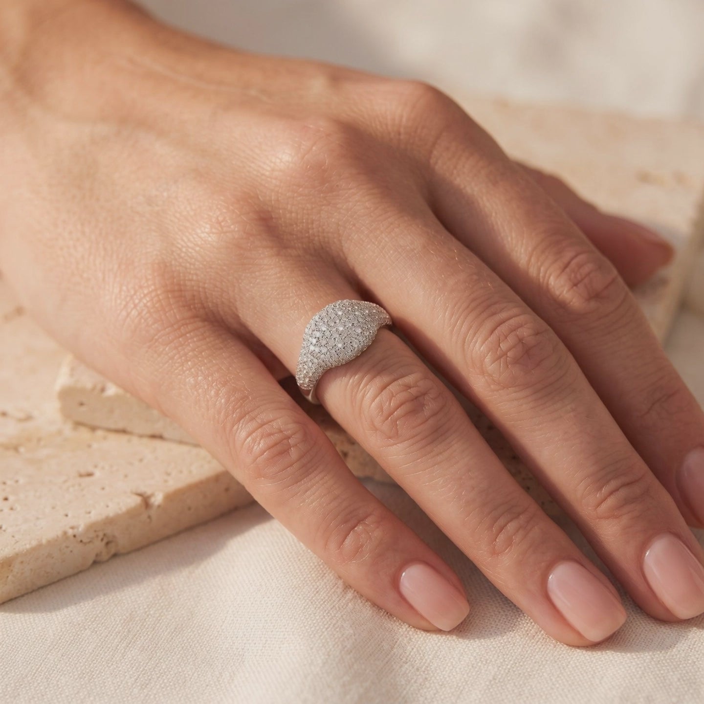 14K and 18K solid gold pave dome ring in white gold with simulated diamonds.