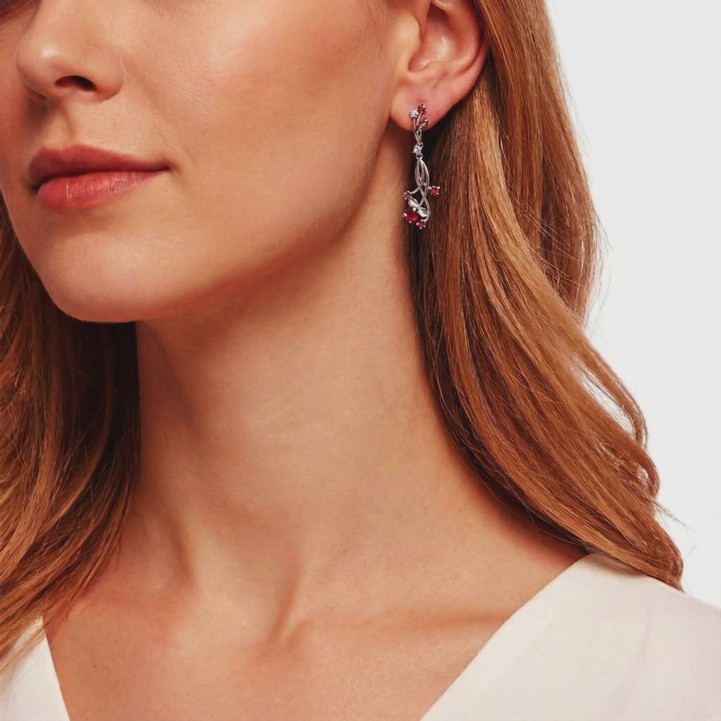 Valisara solid gold drop earrings with simulated rubies.