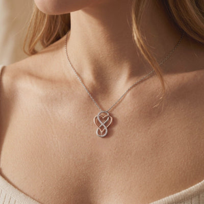 Awareness Avenue moissanite infinity heart solid gold necklace.