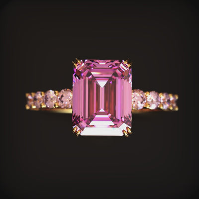 Video preview displaying a direct front view of the 1CT emerald-cut pink moissanite ring in solid gold.