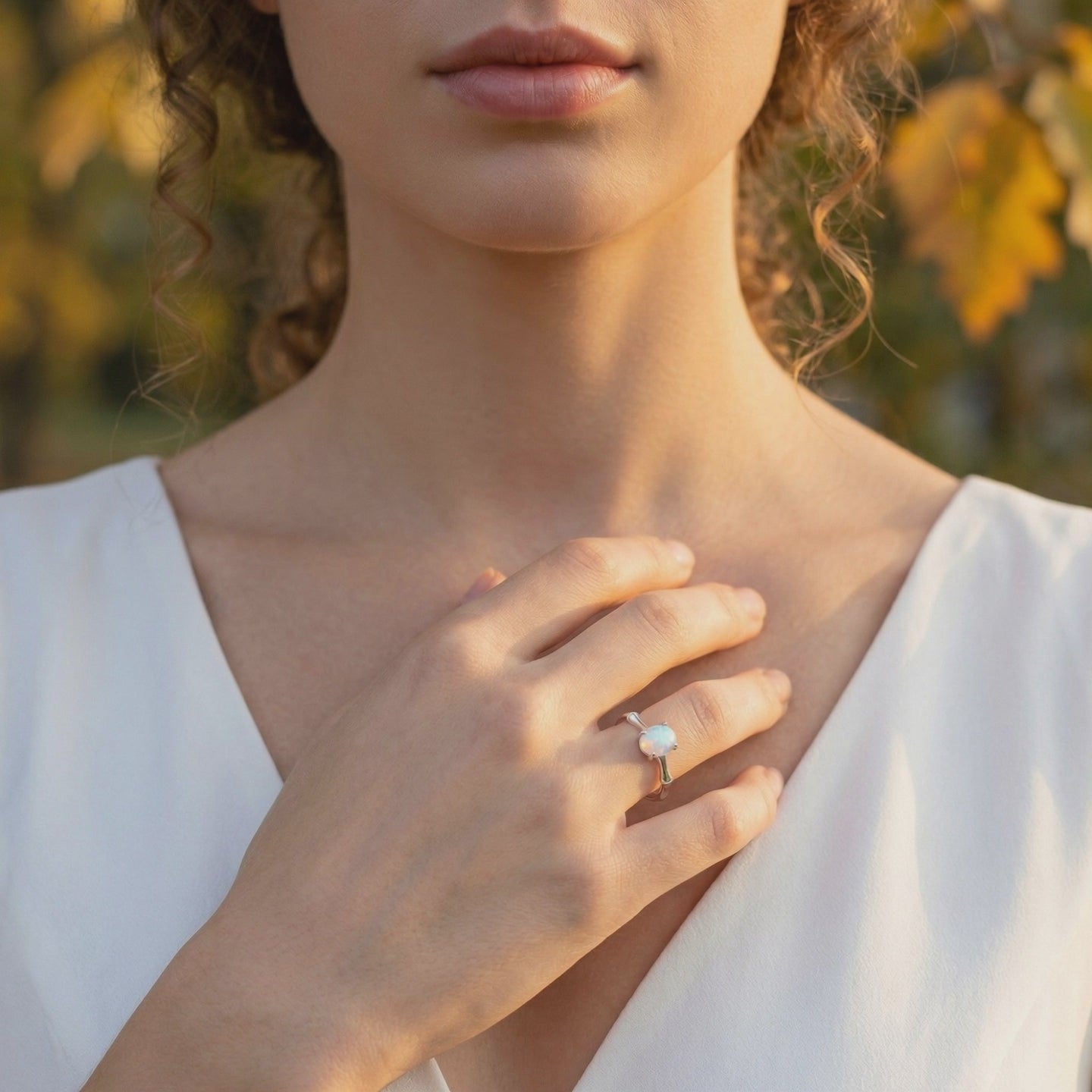 Solid gold ring featuring a natural opal gemstone.