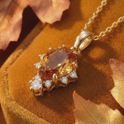 Video showcasing the pear-cut Simulated Topaz solid gold necklace.