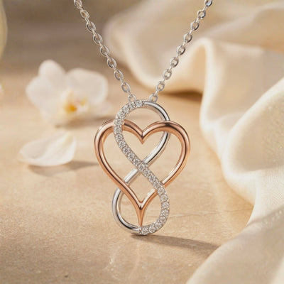 Awareness Avenue moissanite infinity heart solid gold necklace.