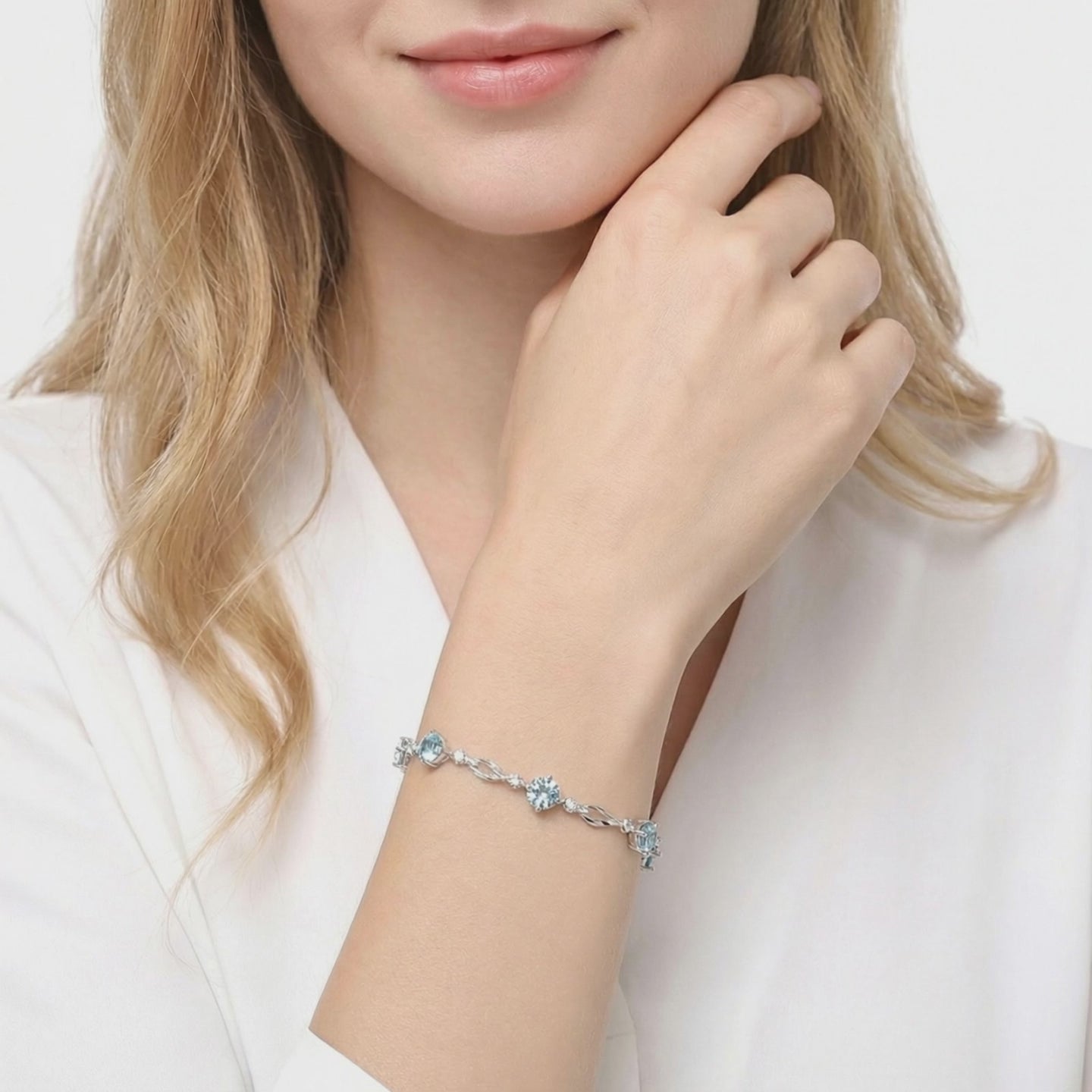 Solid gold bracelet with simulated aquamarine stones.