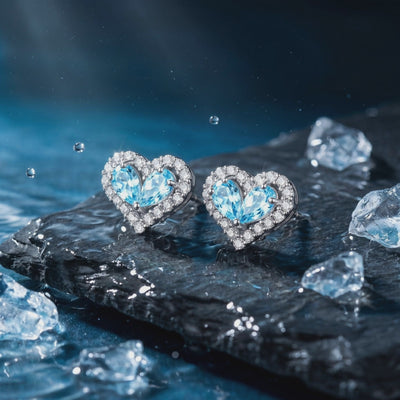 Heart-shaped natural aquamarine drop earrings in solid gold.