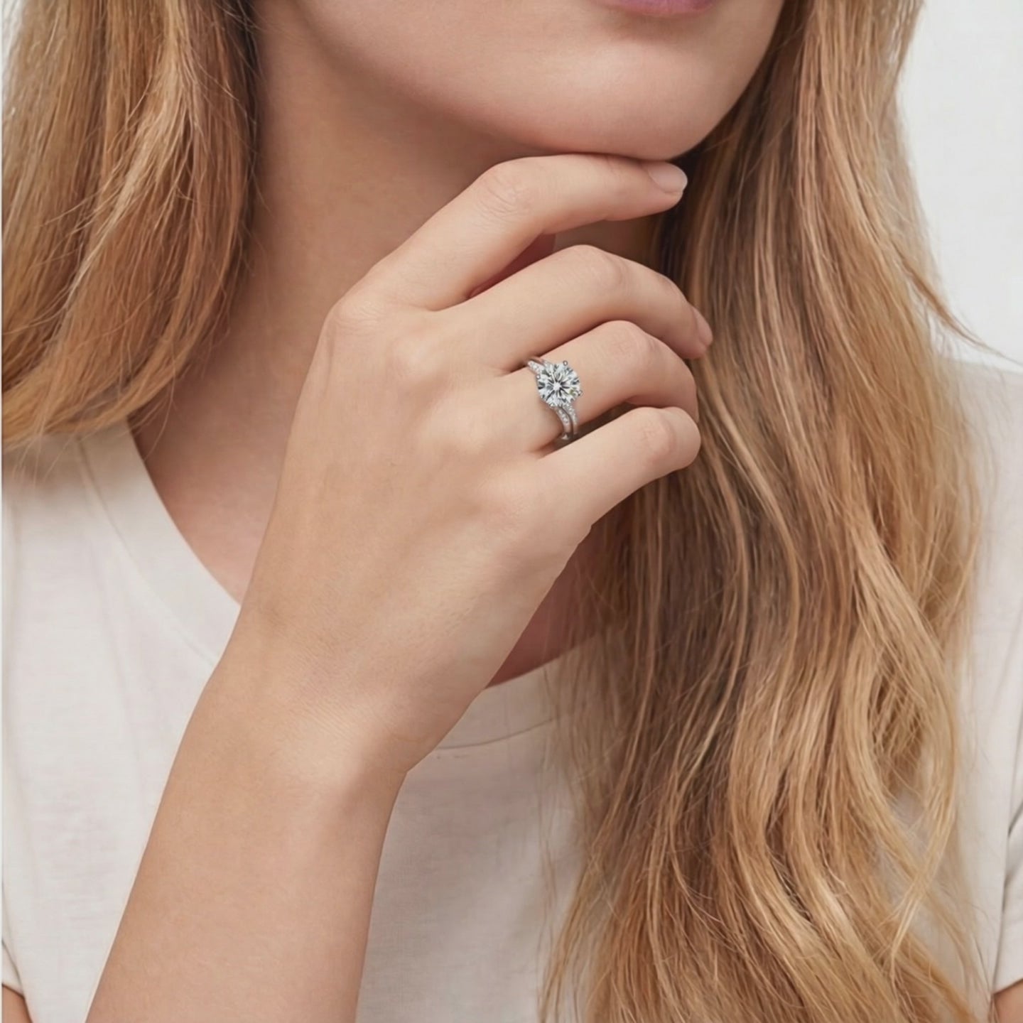 A solid gold ring with a simulated diamond.