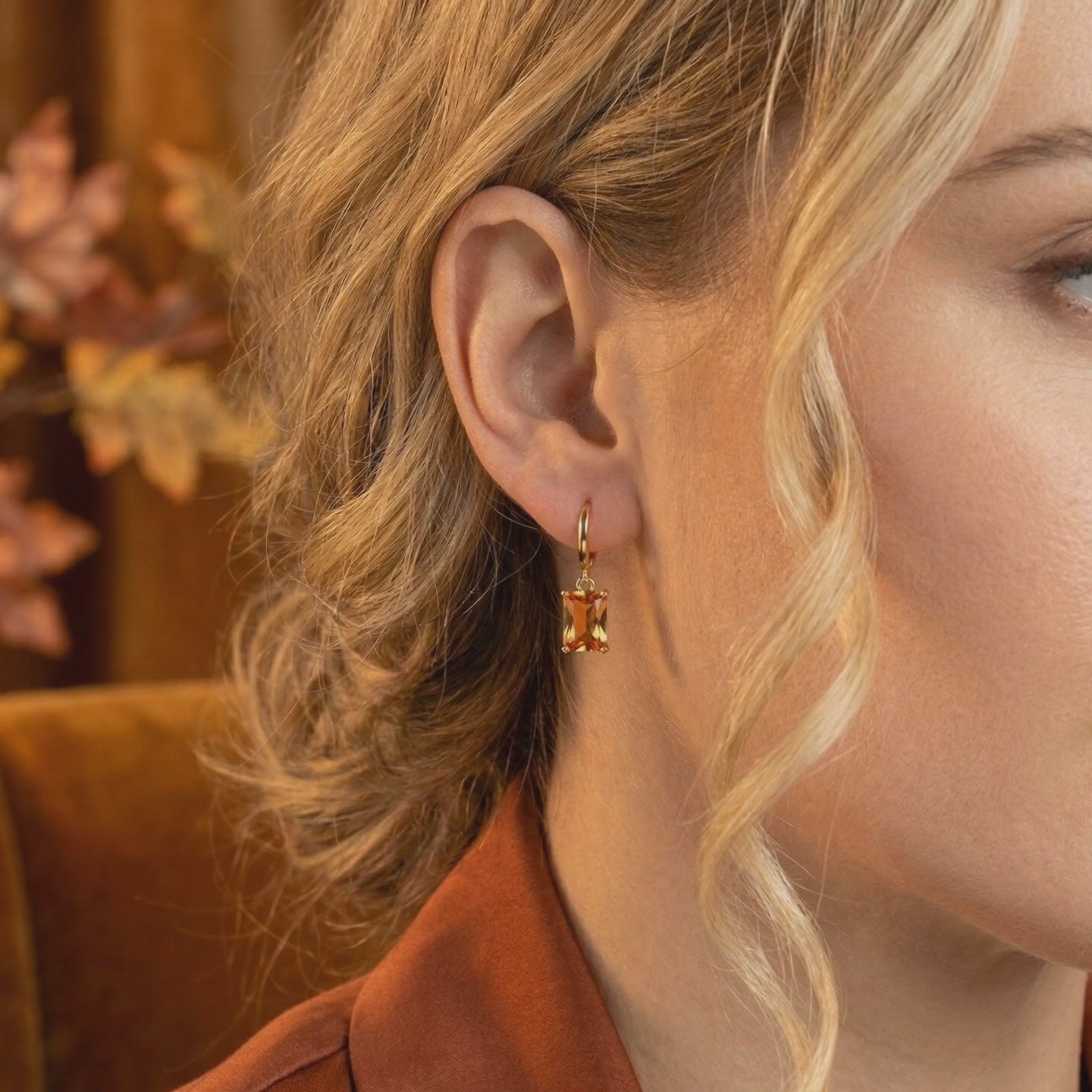 Solid gold drop earrings with simulated topaz.