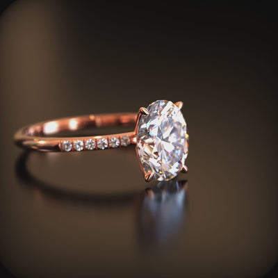Video of an oval moissanite ring in solid gold.