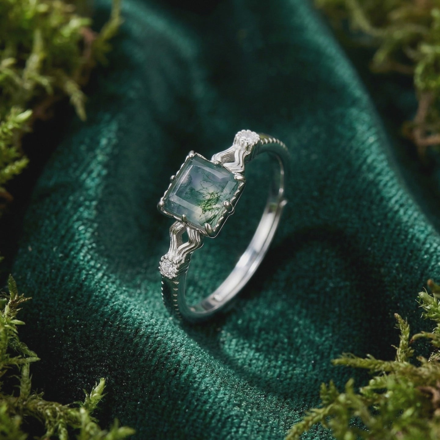 A solid gold ring with a natural moss agate gemstone.
