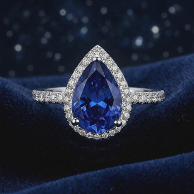 Simulated sapphire halo ring in solid gold.