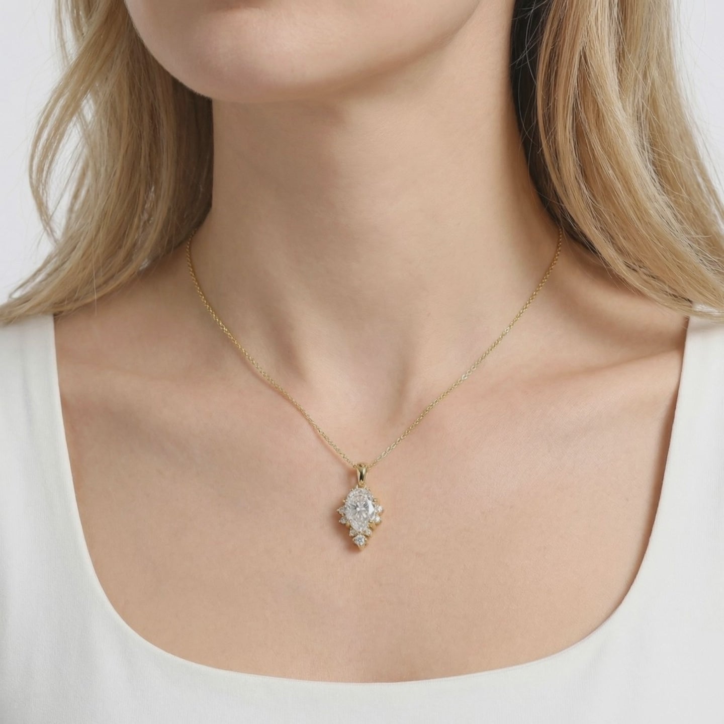 Solid gold necklace with pear-cut A5 Zirconia pendant.