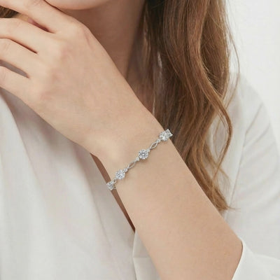 A solid gold bracelet with simulated diamonds.
